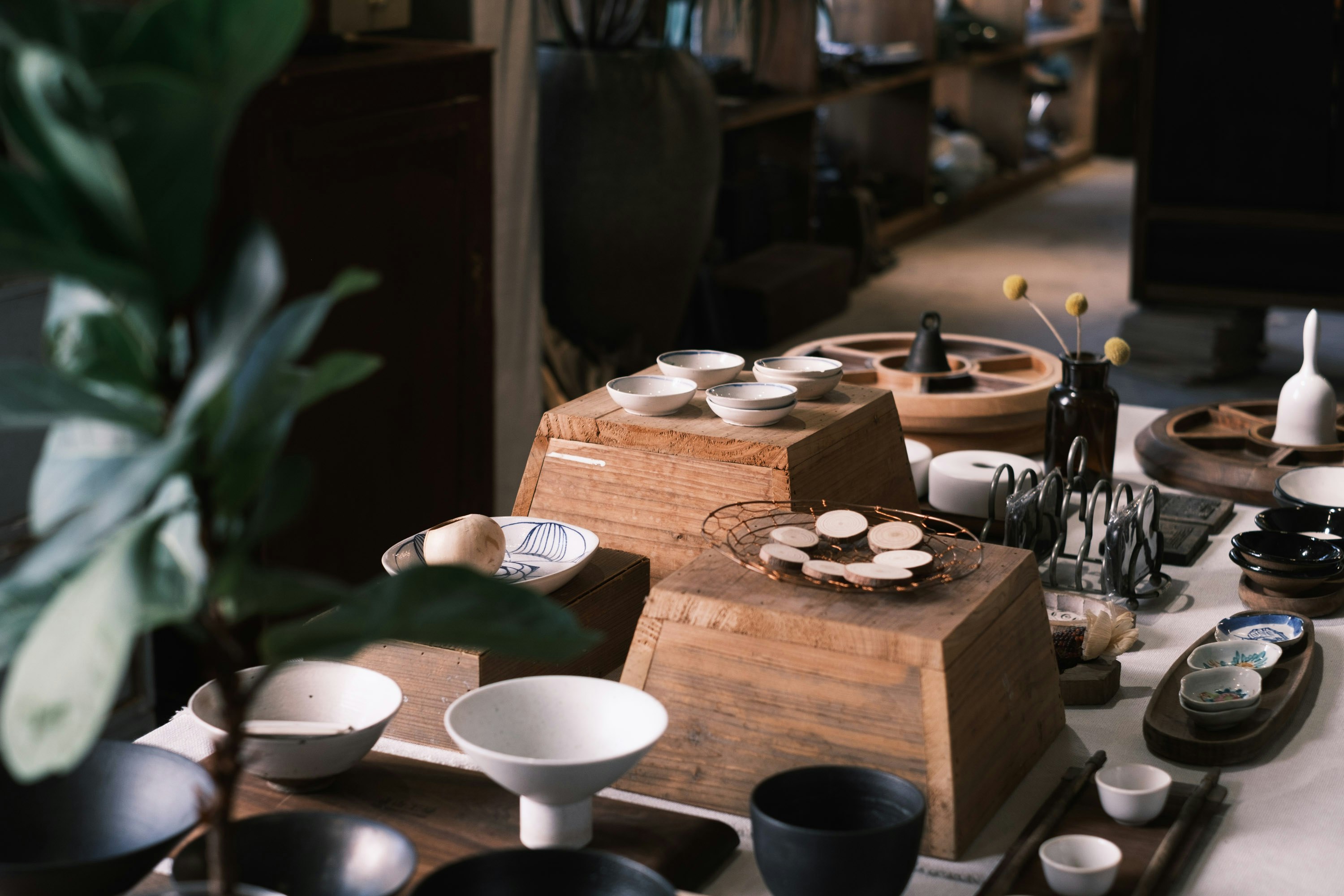 white ceramic bowl on brown wooden table